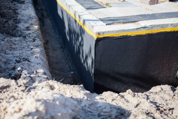 Professional Waterproofing technician working in Milford, PA